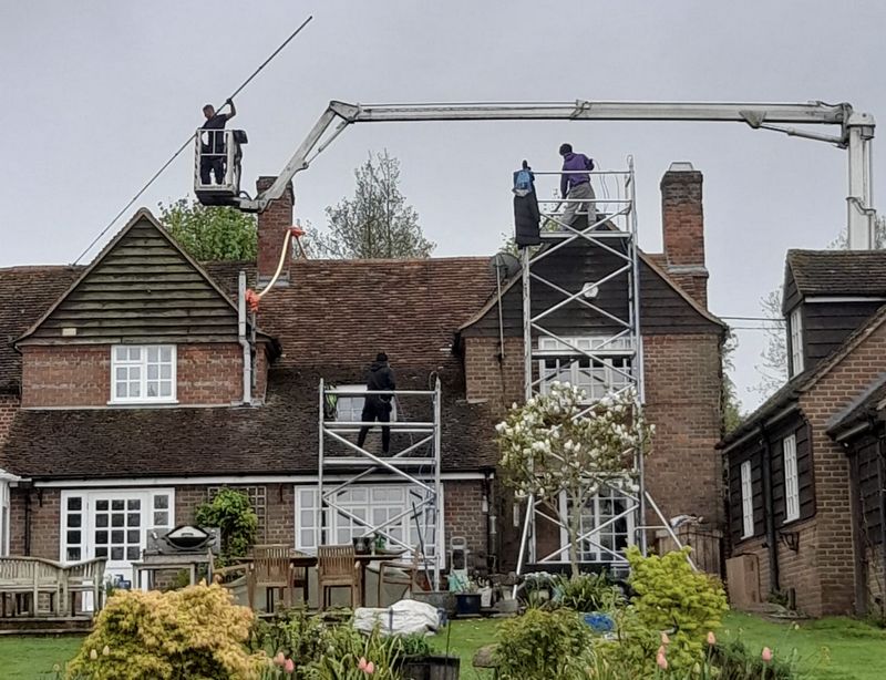 The Roof Moss Cleaners using cherry picker and scaffolding to clean roof safely and professionally in Eastbury, Hertfordshire